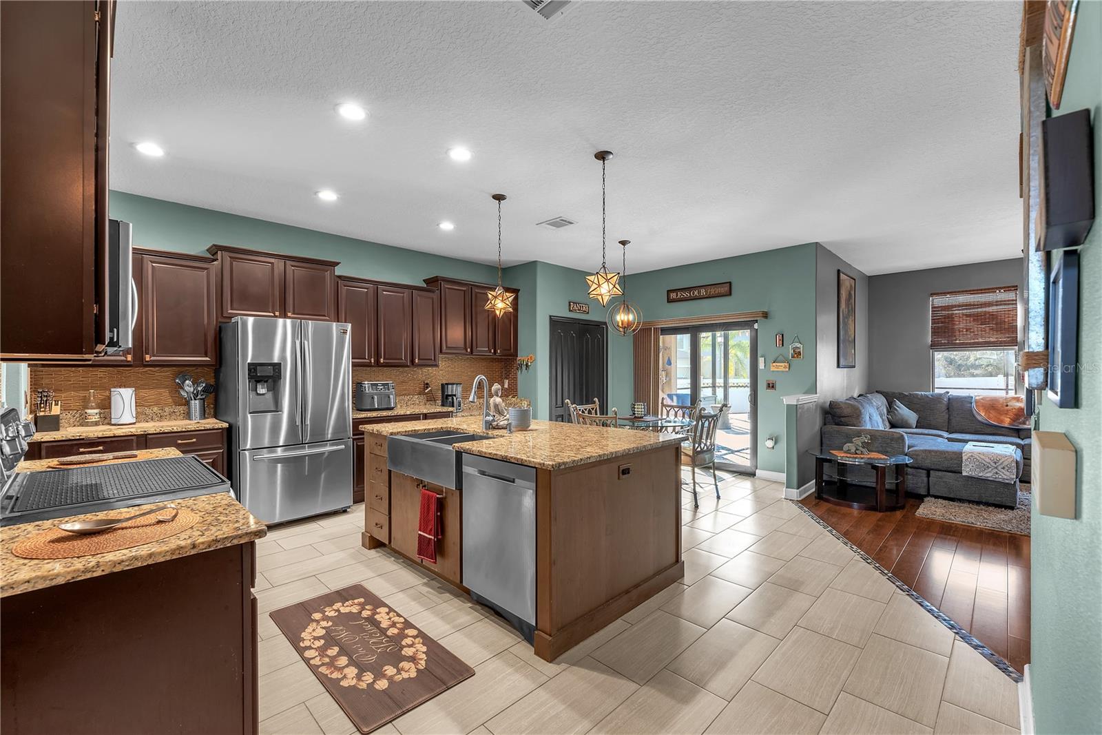 Kitchen/nook/living room with sliders to pool deck