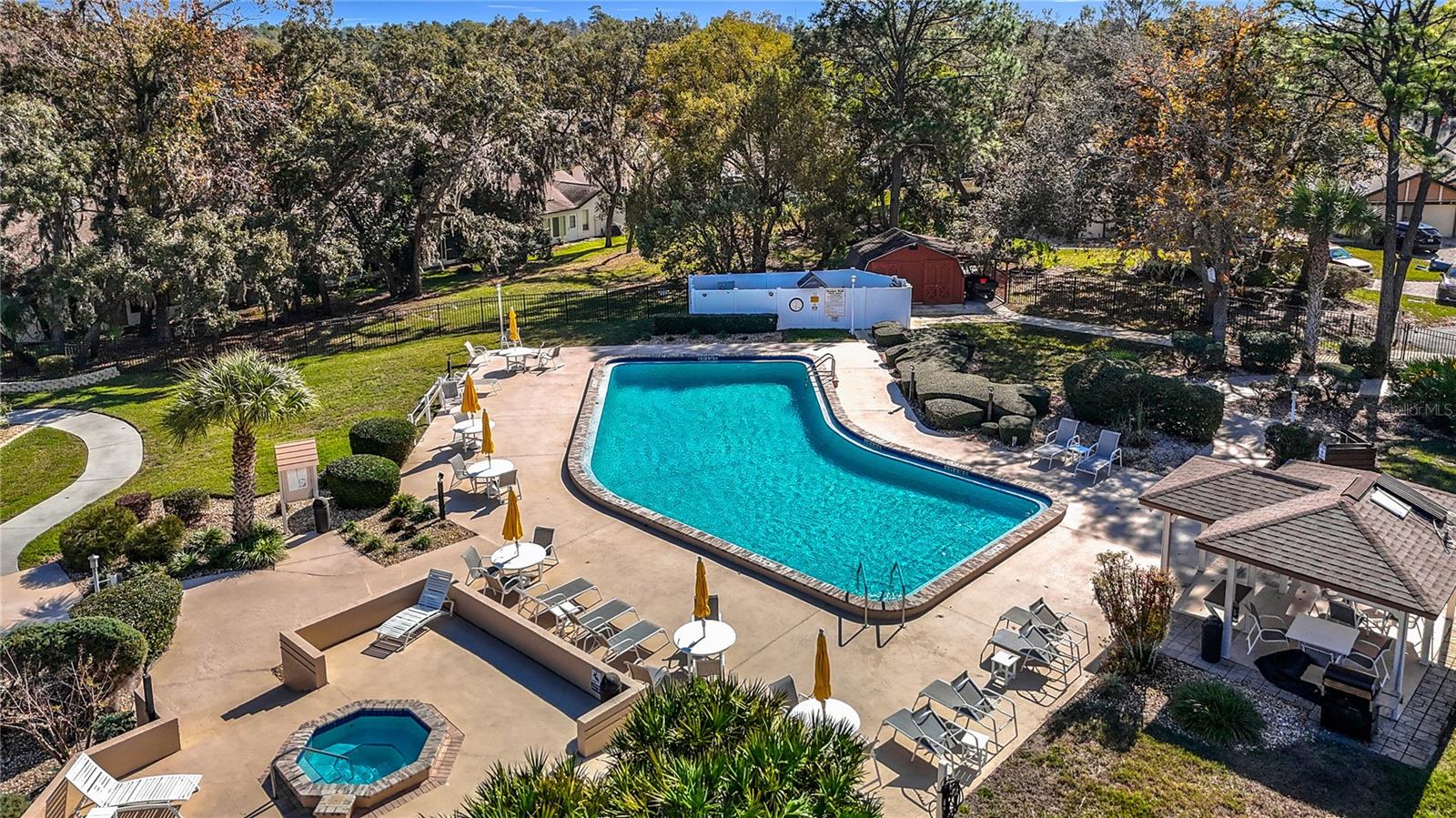 Drone image of Community pool and patio area