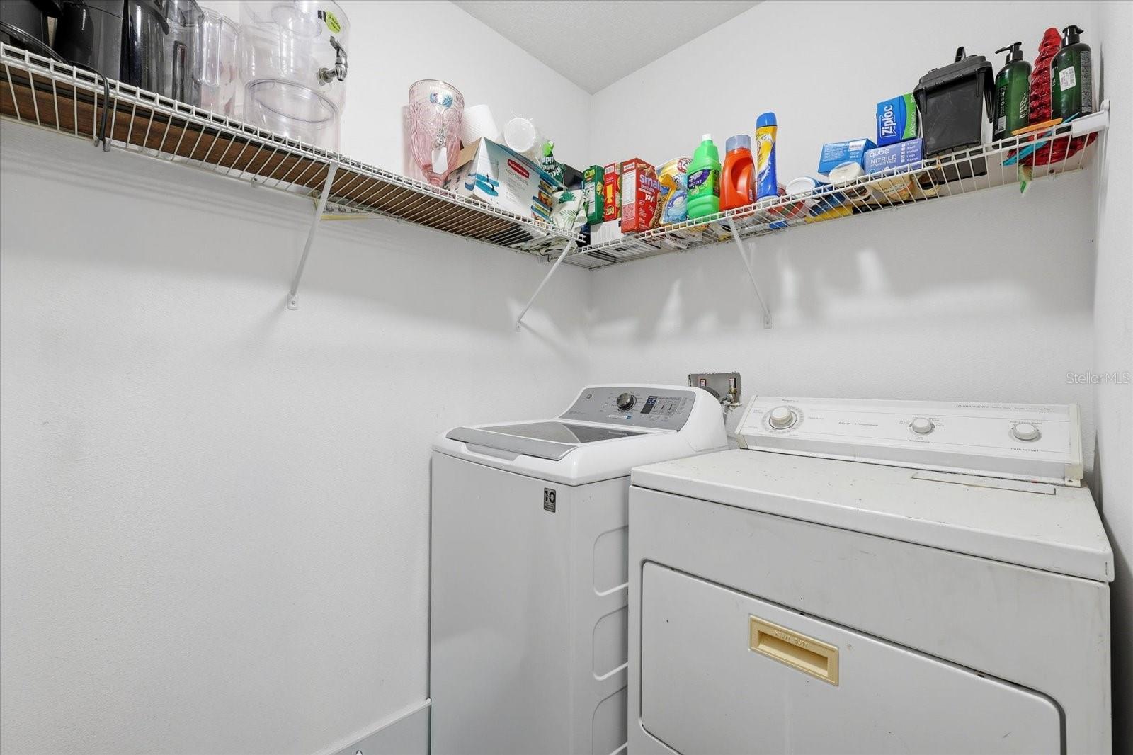 Laundry room and storage off kitchen