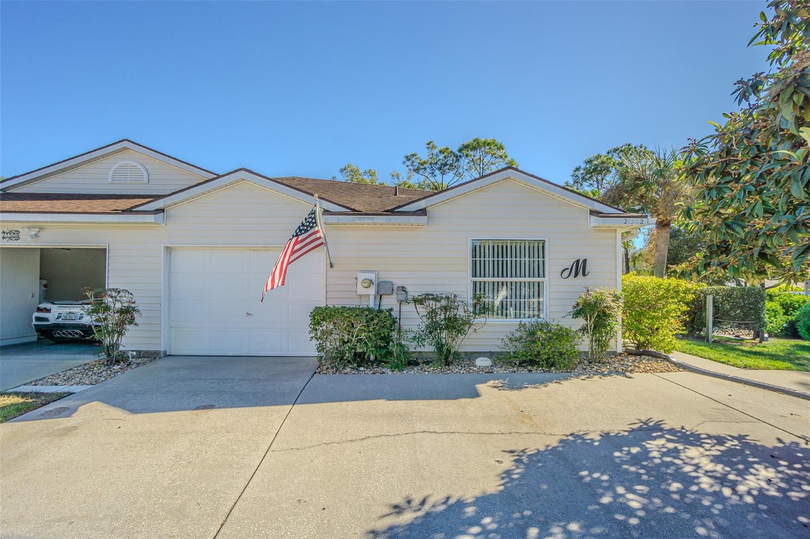 1 car garage, but has a 3 car, circular driveway! Corner lot location!!!