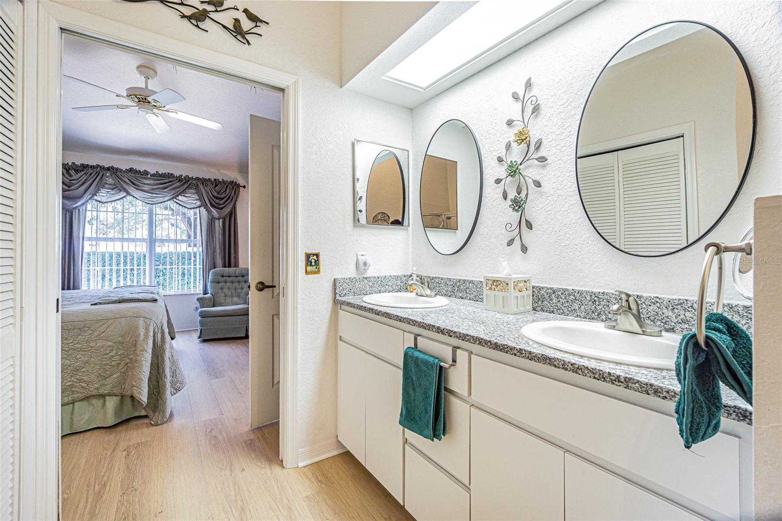 Primary Bathroom- Dual vanity, Granite Top, privacy door.