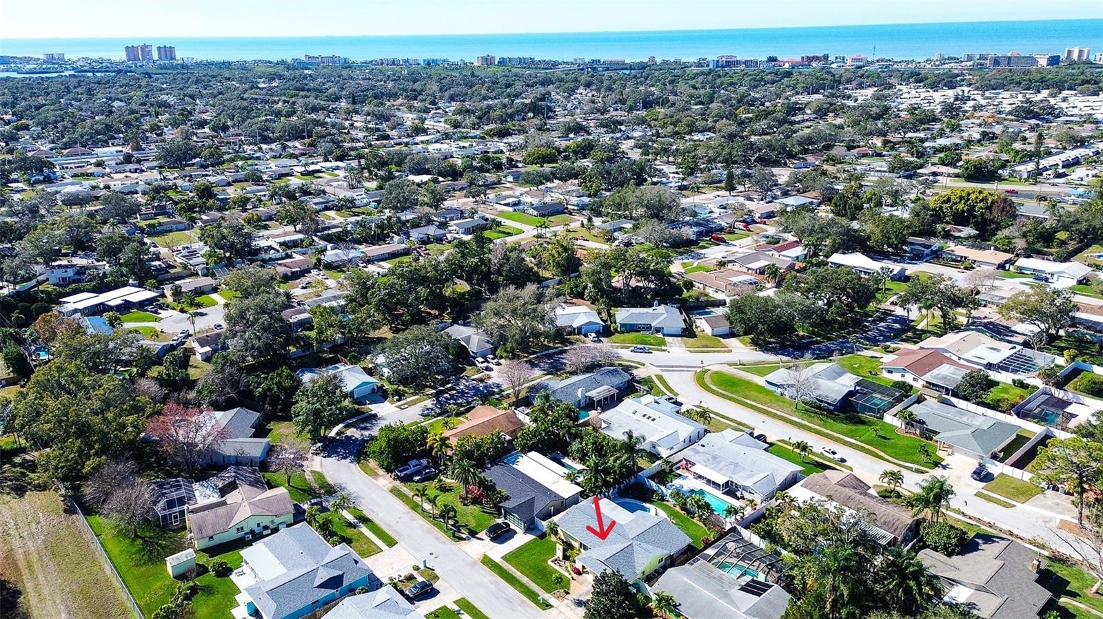 Aerial View of House with Gulf in Background
