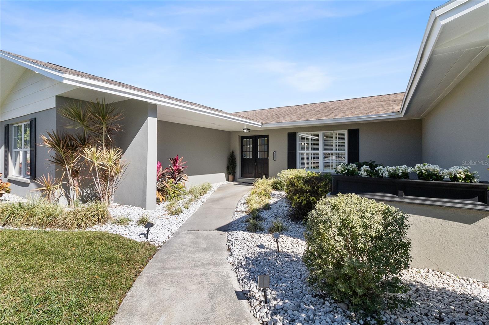 Front walk way to double front doors.