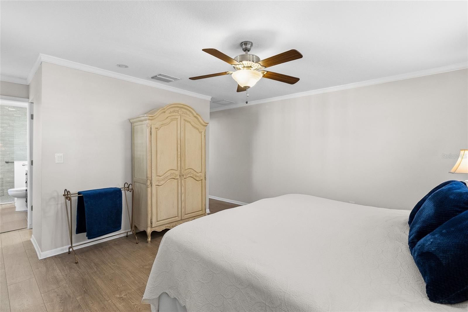 Primary suite looking toward the walk in closet and ensuite bath.