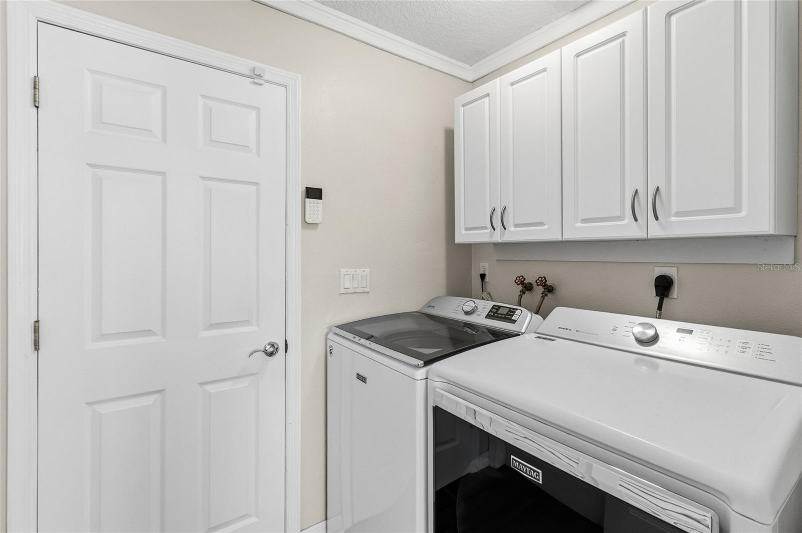 Fully interior laundry room - appliances included. Goes to garage door and the opposite side has a full closet for storage.