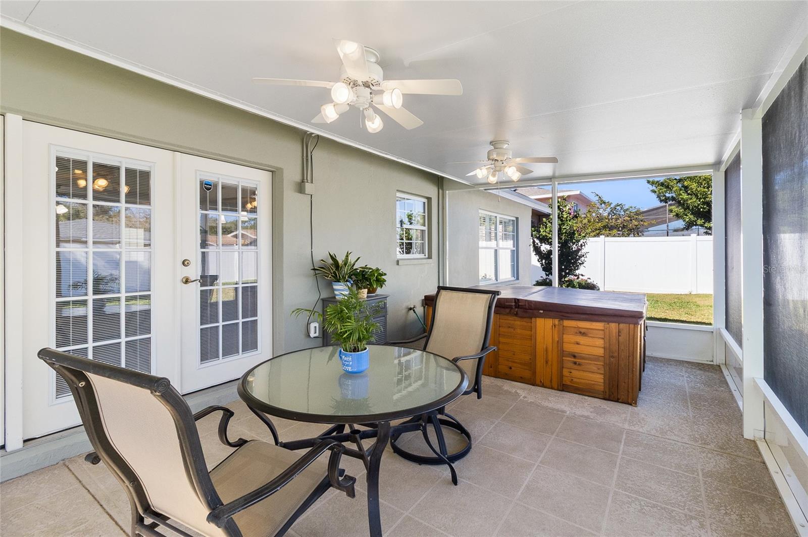 Screened in porch with hot tub - included.