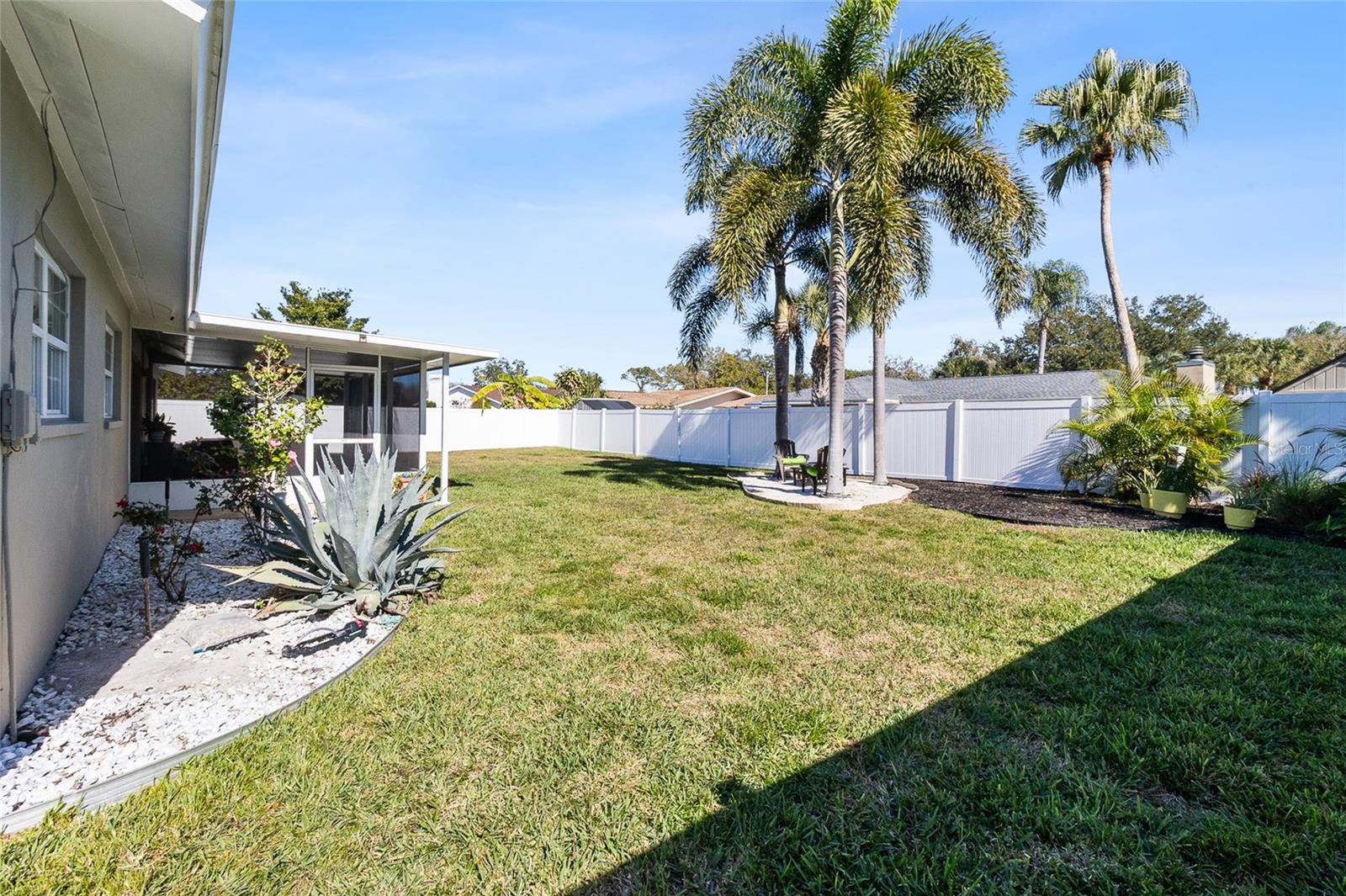 Fully fenced back yard - new vinyl fence.