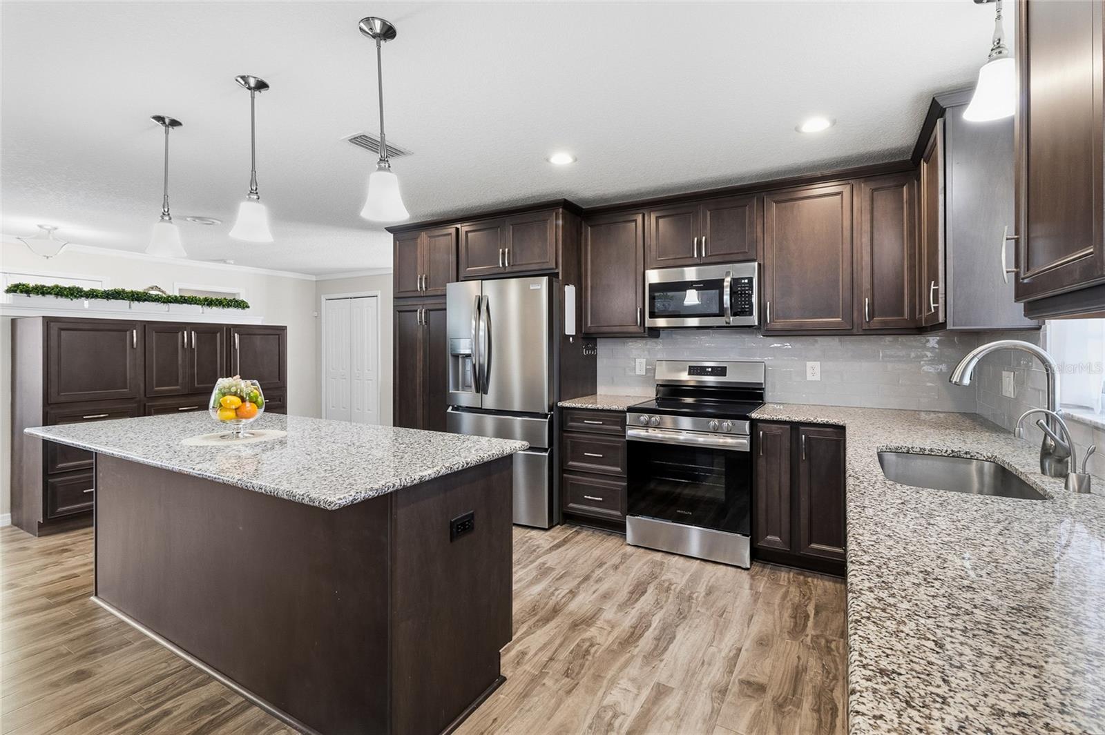 Kitchen area looking foward the front door