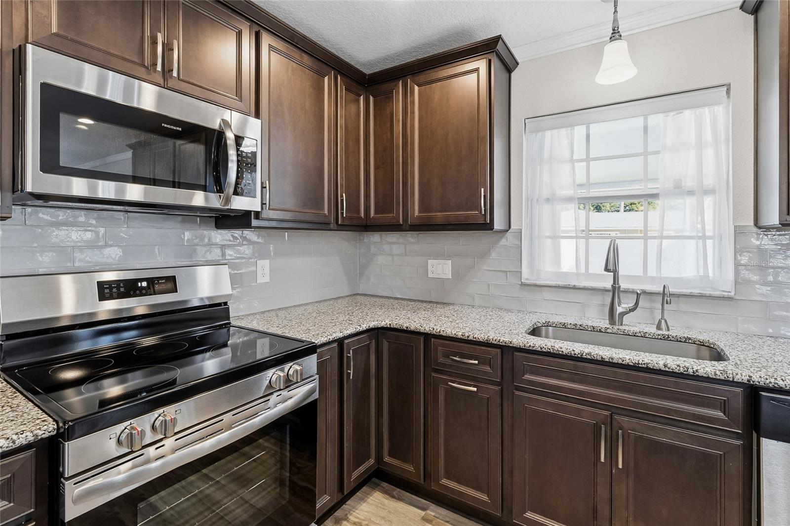 Closer kitchen area.  Brand new microwave, oven/rage and dishwasher.