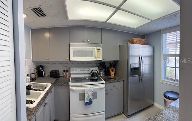 ALL FLOORING THROUGH OUT IS THE SAME. NO CARPET.   KITCHEN WINDOW.  PASS THROUGH WINDOW - GRANITE