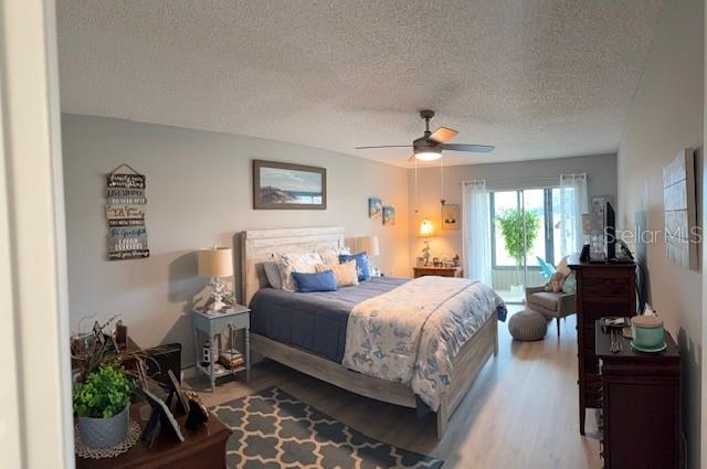 VERY LARGE PRIMARY BEDROOM WITH DOUBLE SLIDER TO FLORIDA ROOM - AMAZING VIEWS FROM THE BEDROOM