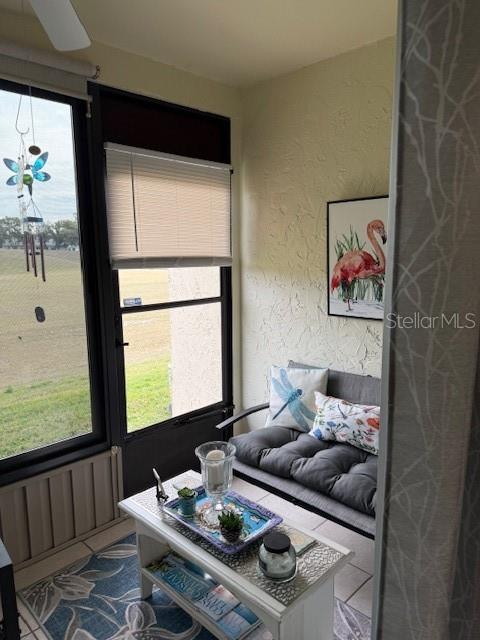 FLORIDA ROOM WITH CEILING FANS.