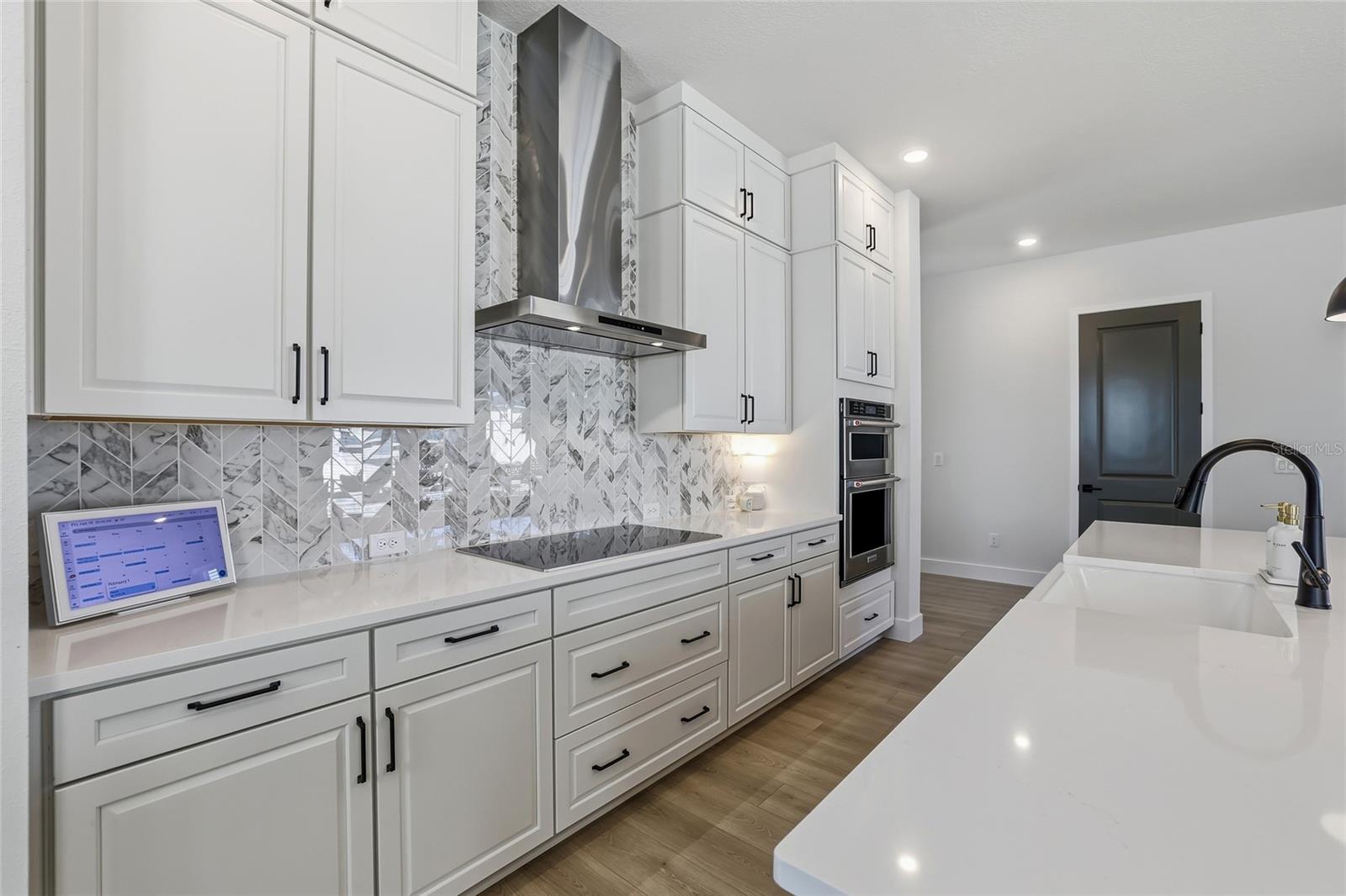 Vented hood over the induction cooktop for the true chef.