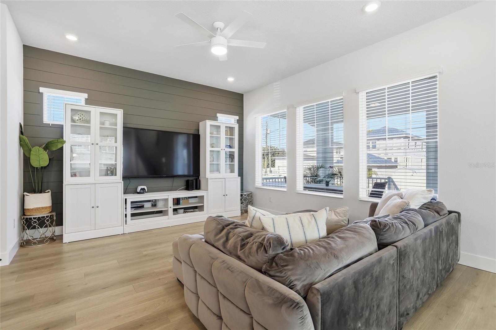 Consistent flooring throughout the home sets the scene for relaxation and together time.