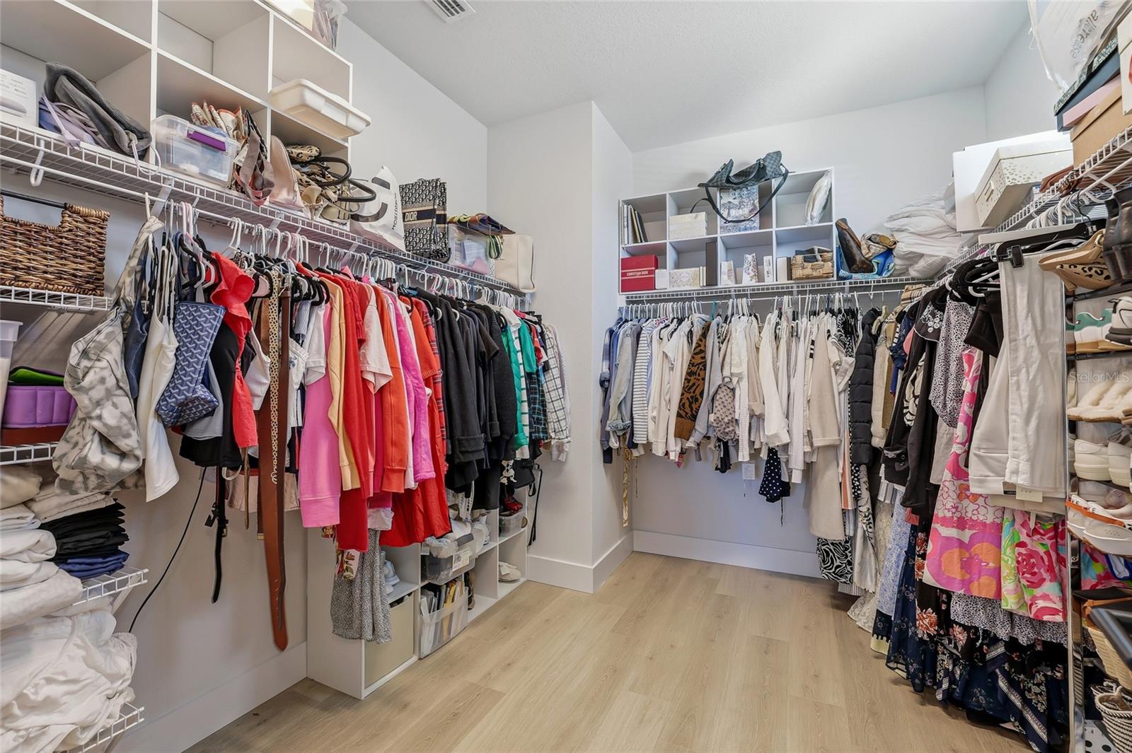A closet of your dreams in the primary.
