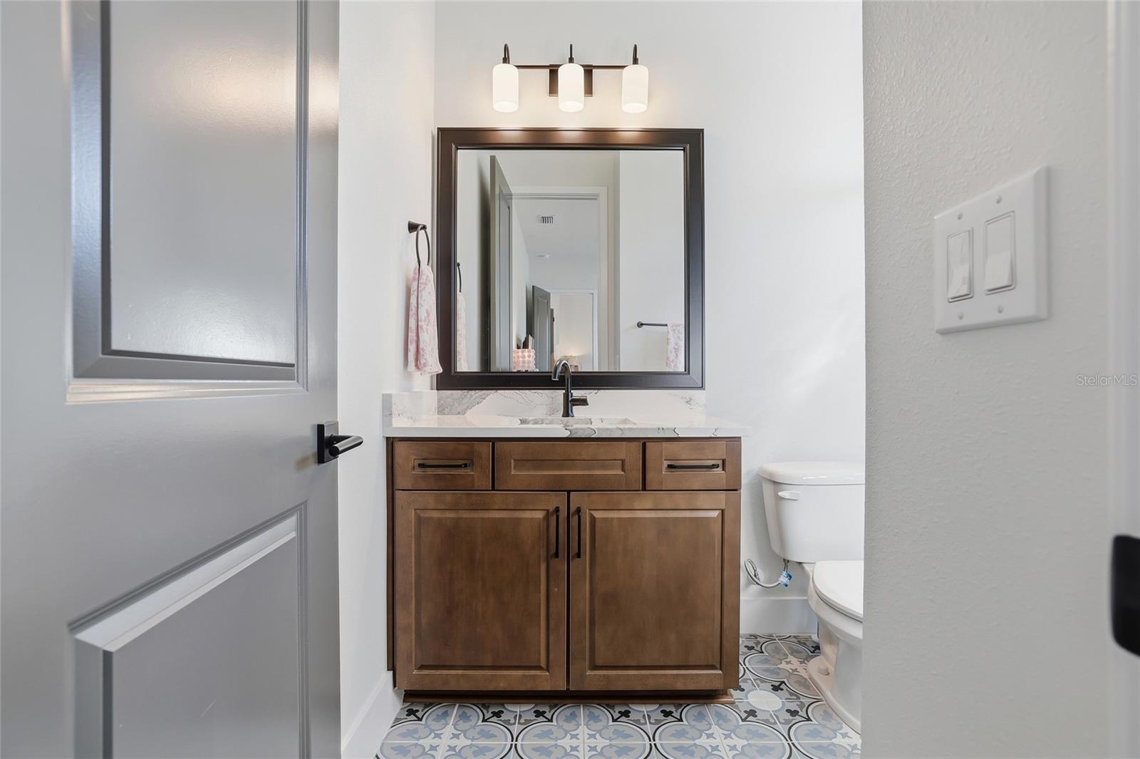 En-suite full bathroom within the downstairs bedroom.