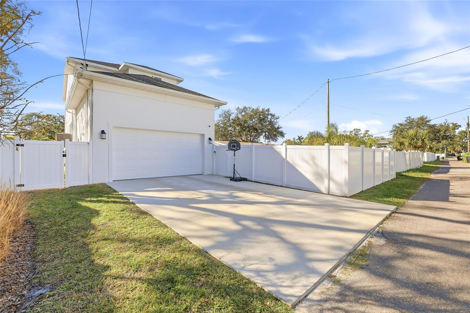 Attached 2-car garage and large driveway in the rear of the home.