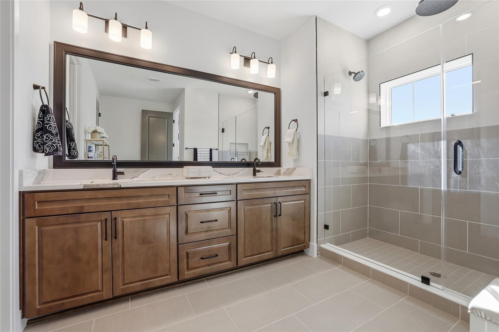 Amazing primary en-suite bathroom with a soothing step-in shower and massive walk in closet.