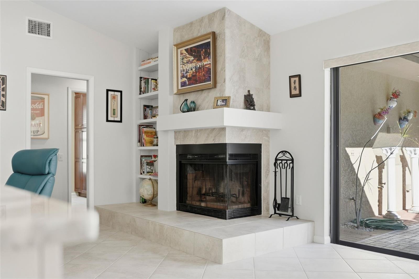 Wood burning fireplace in leisure room.