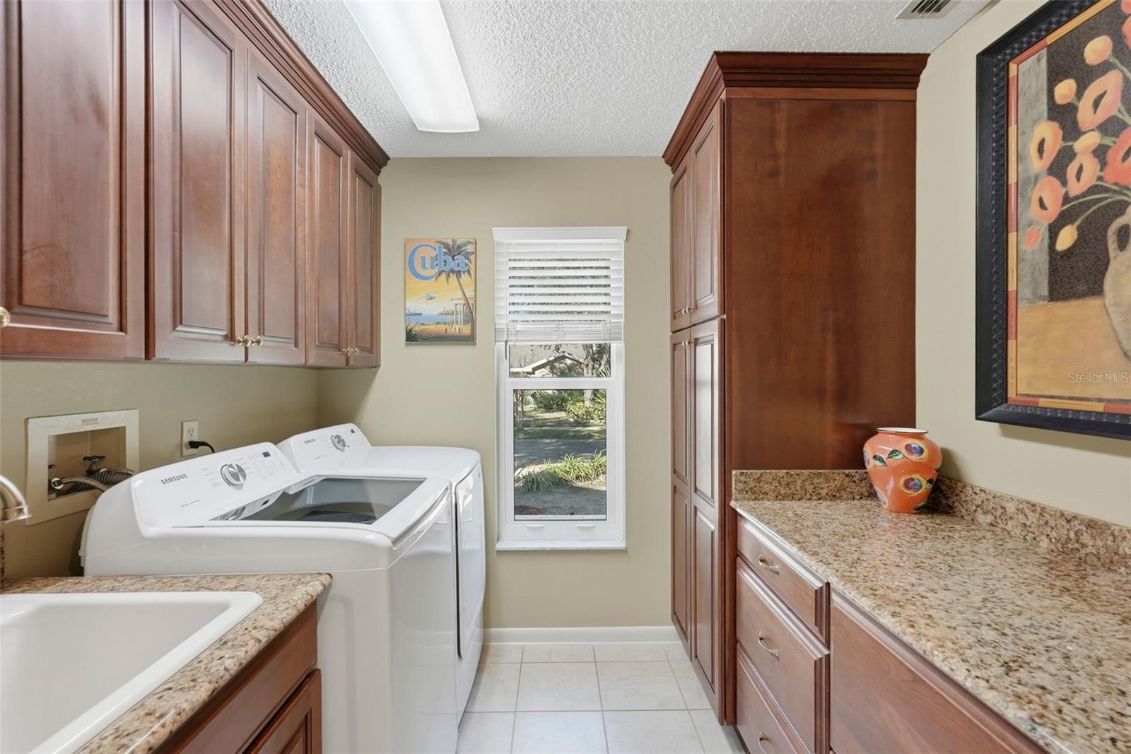 Lots of storage in large indoor laundry room.