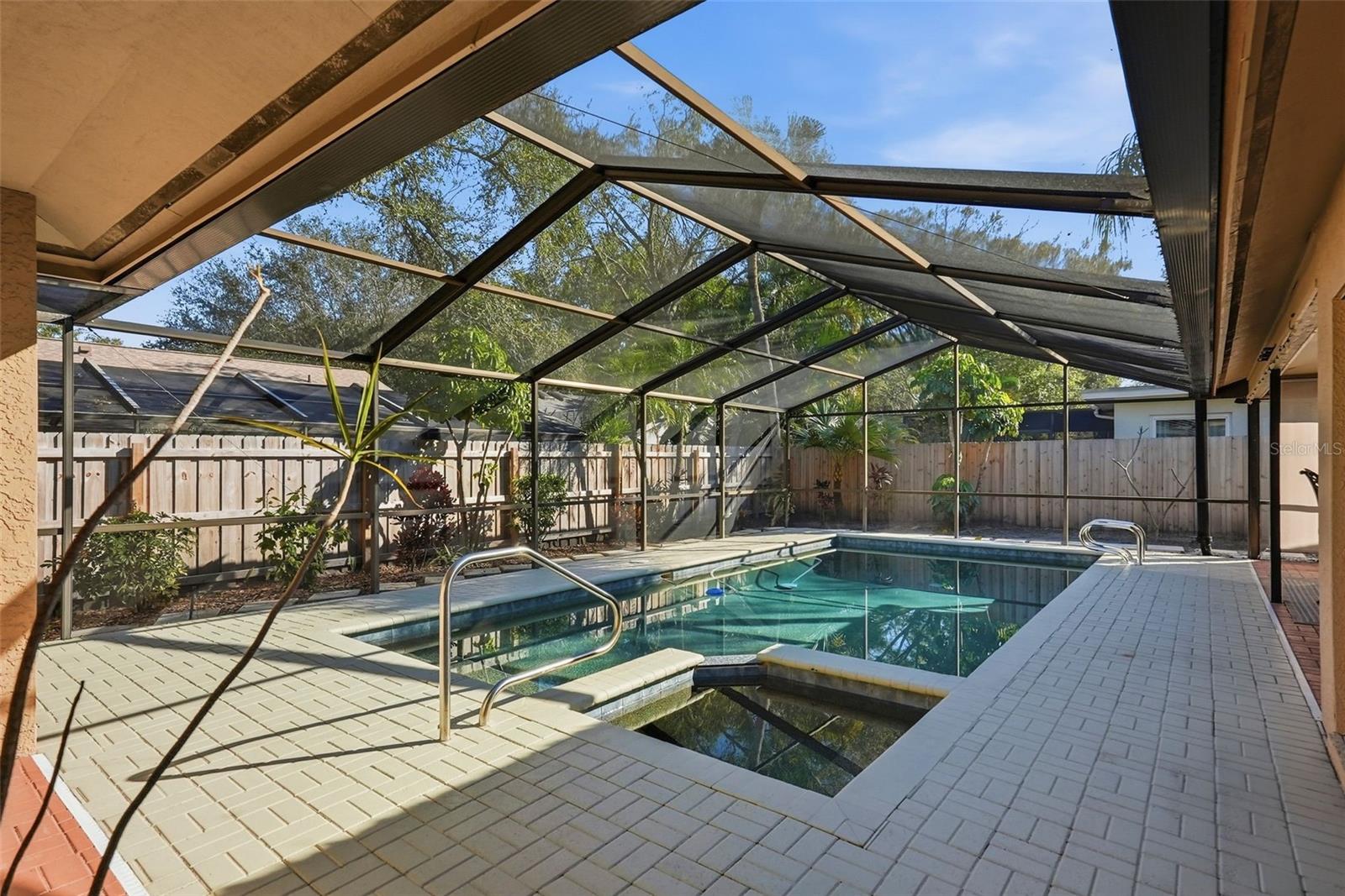 Pool area with screened porch.