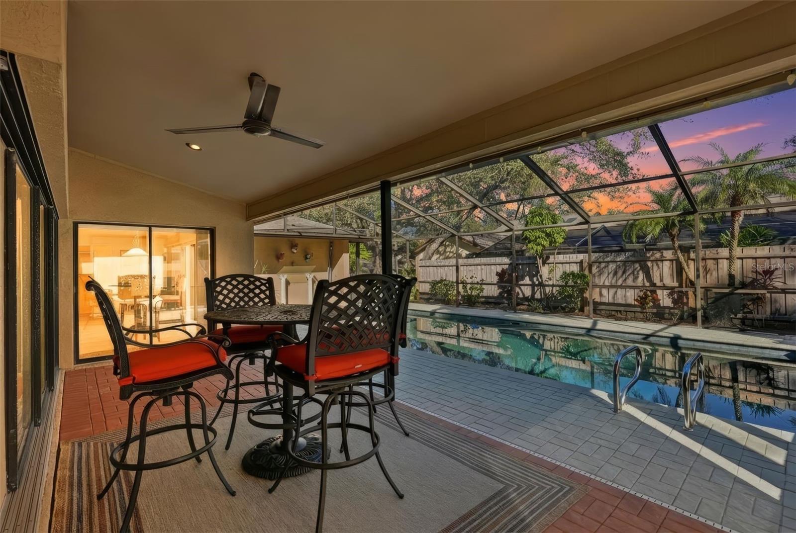 View of covered back porch and pool area.