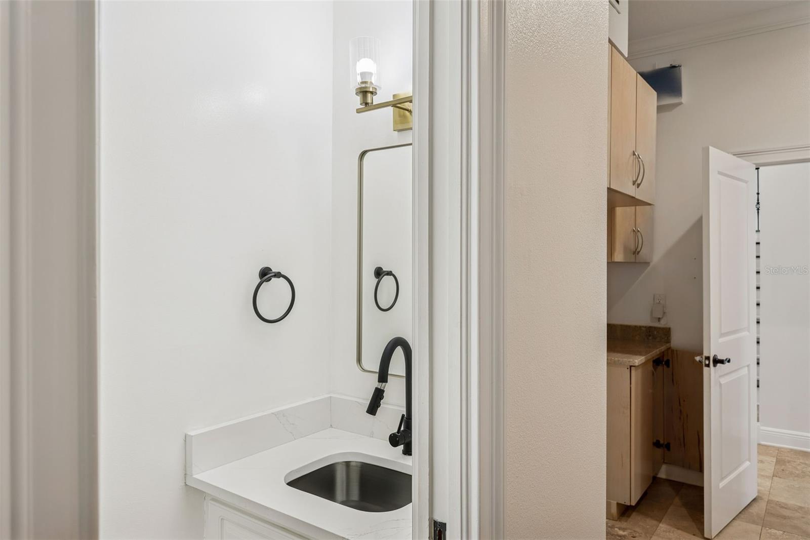 1/2 Bath by garage/laundry