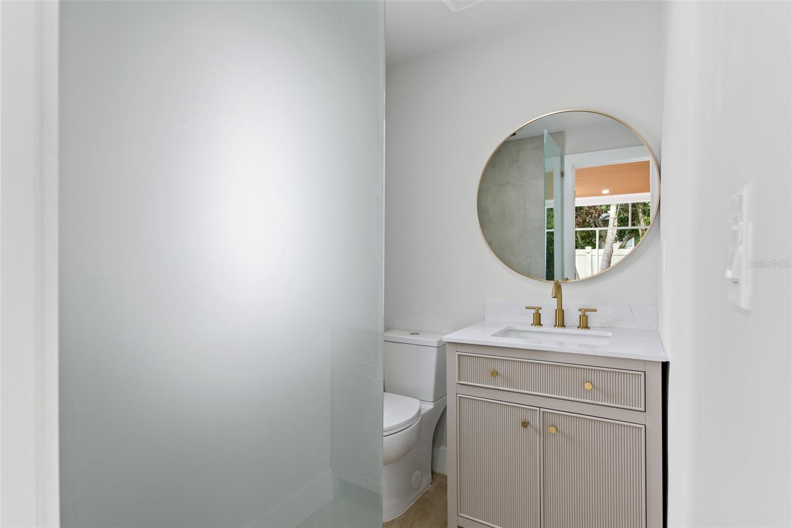 Den/game room bathroom with shower