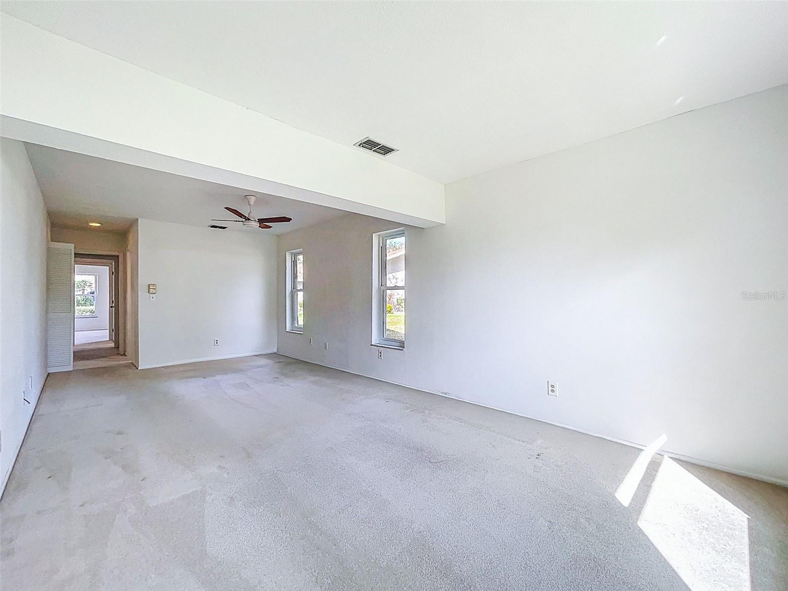 Primary bedroom has pocket door, en-suite bathroom and walk-in closet.