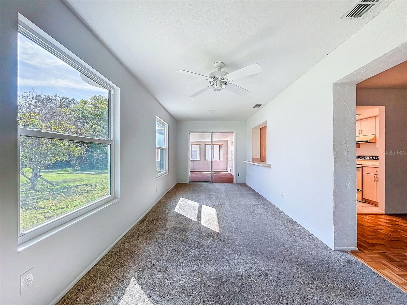 Sliding glass doors to enclosed rear porch area