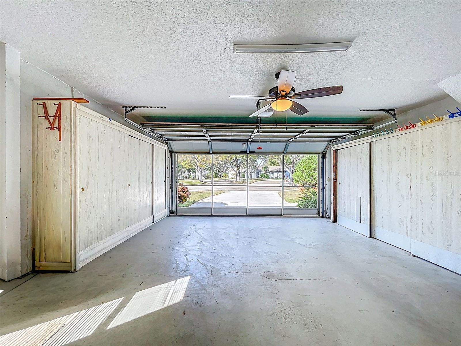 Garage with storage cabinets on both sides