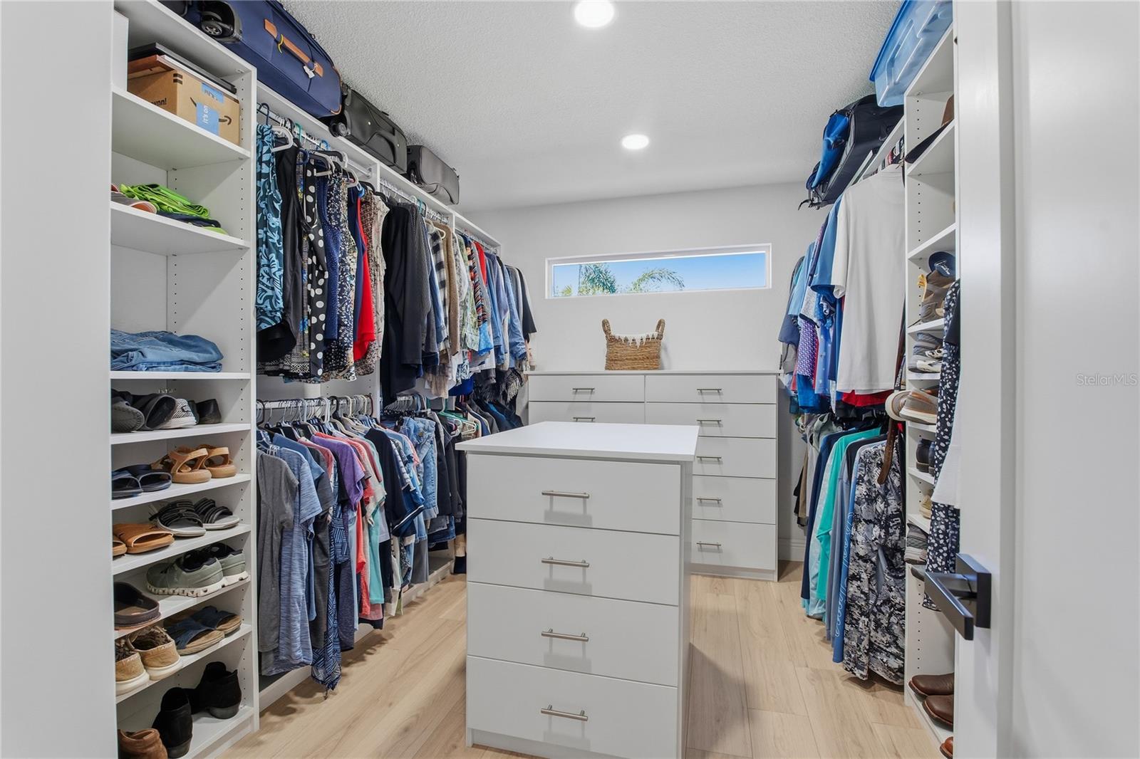 SPACIOUS CUSTOM BUILT AND DESIGNED PRIMARY CLOSET!