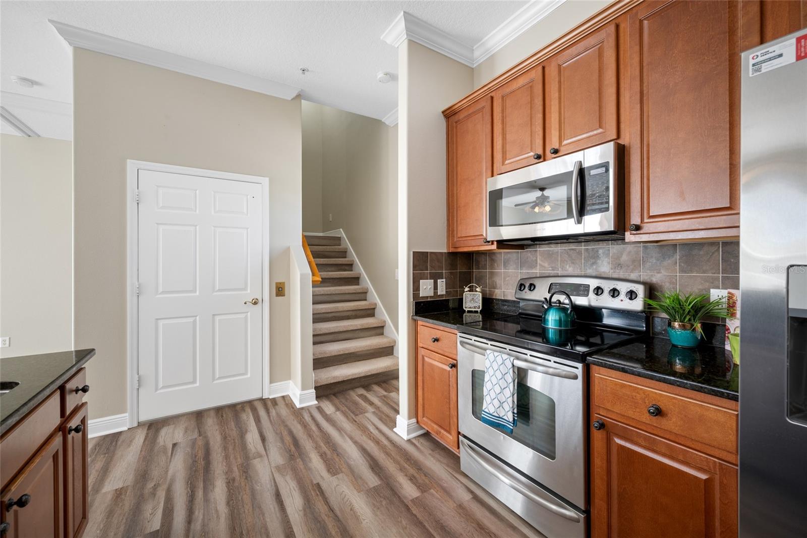 From the kitchen, you can go upstairs using either the stairs or elevator