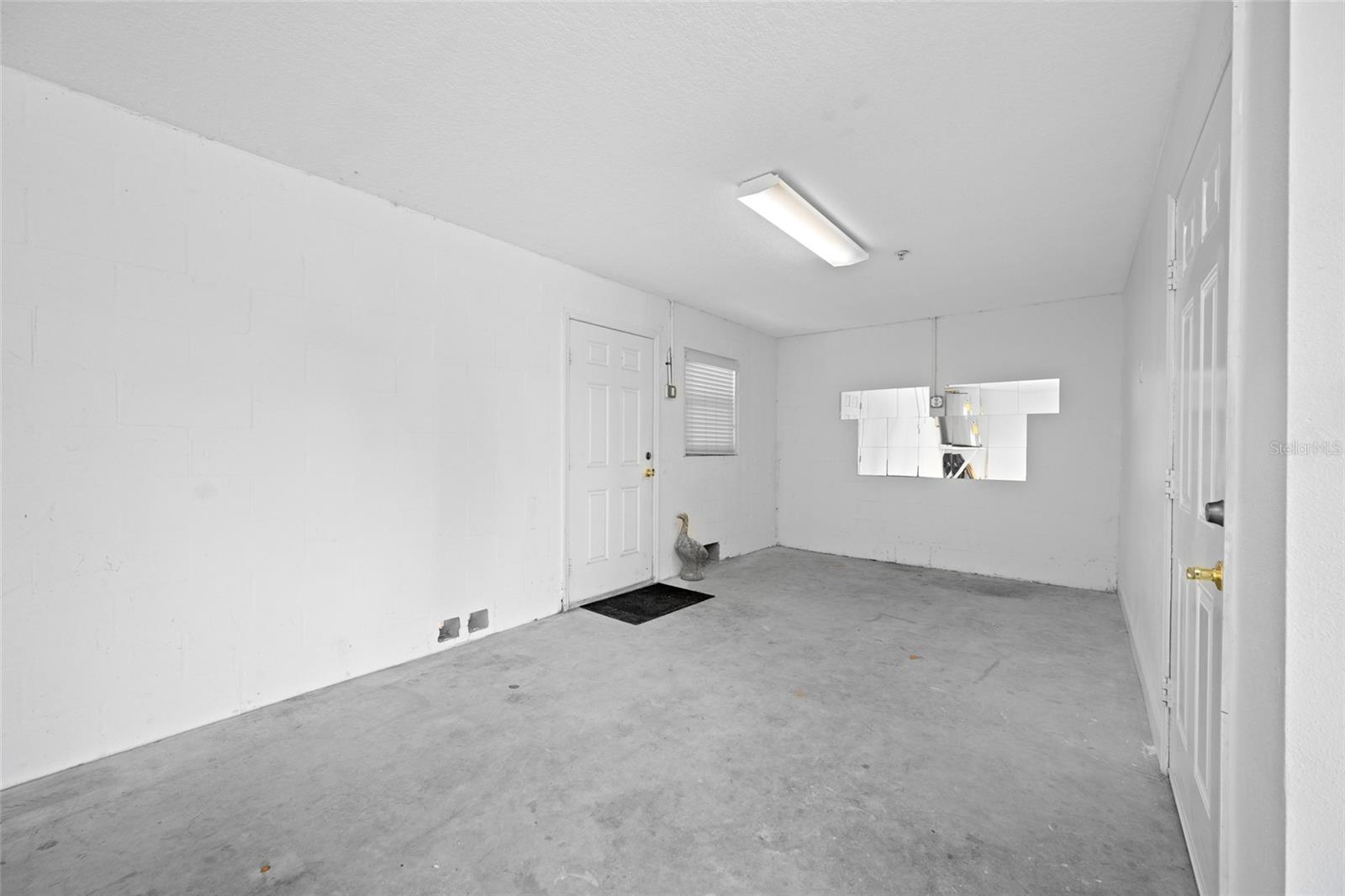 Additional Garage Storage, perfect for motorcycles, golf cart or work out area.