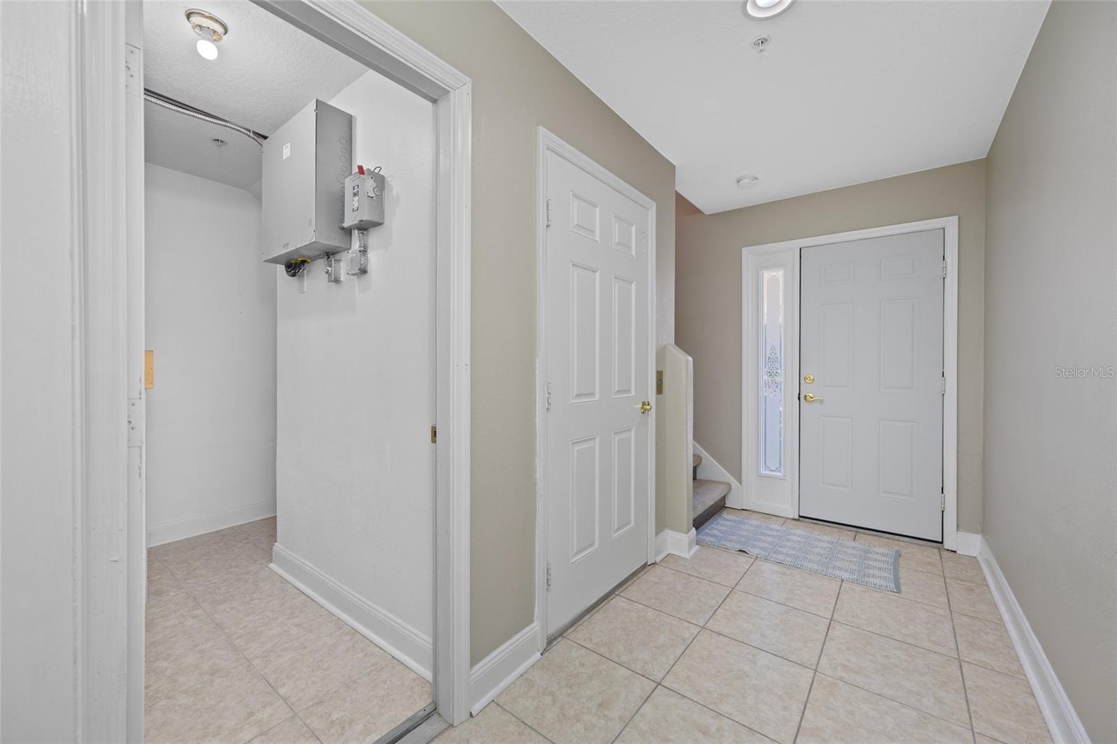 Another view of the front entry way showing access to more storage closets