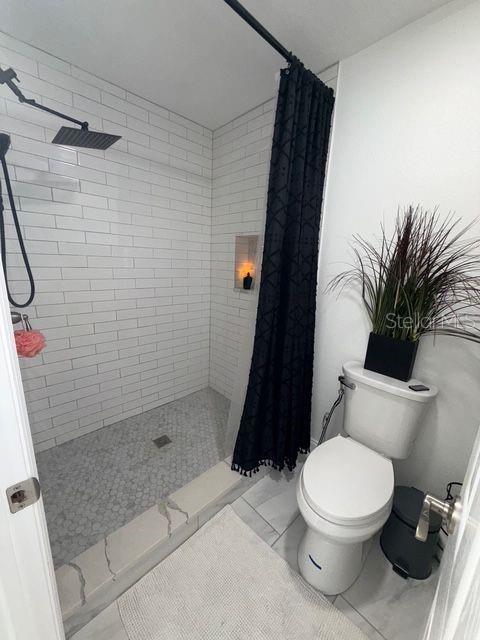 Nicely Tiled Walk-in Shower & New Toilet throughout home