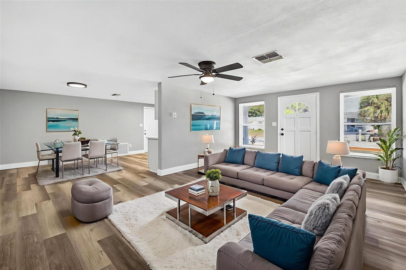 FRONT ENTRANCE INTO LIVING ROOM WHICH IS NEXT TO DINING ROOM *VIRTUALLY STAGED*