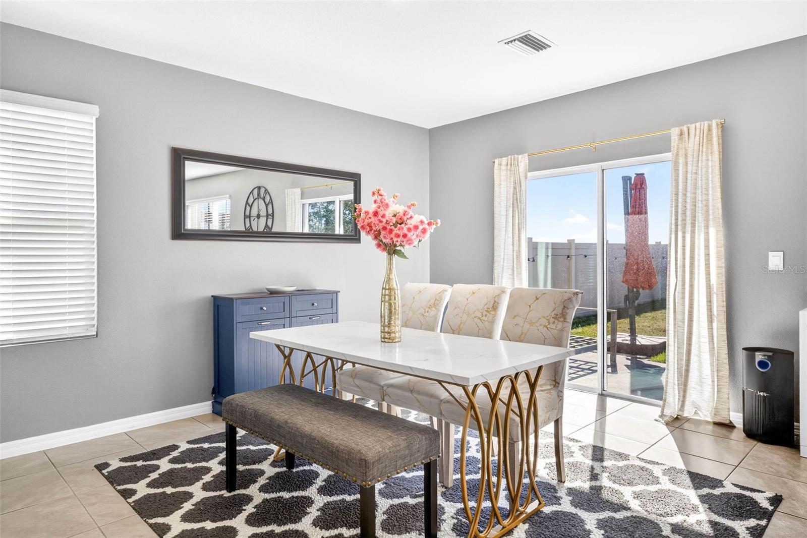 Dining room with backyard view