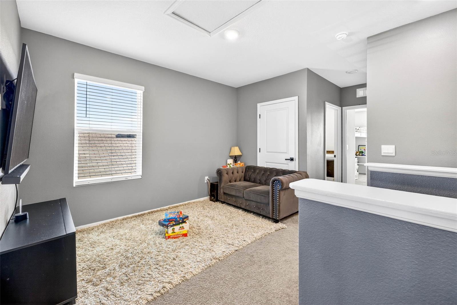 Upstairs the loft area can be used as a second living room, game room, flex area.