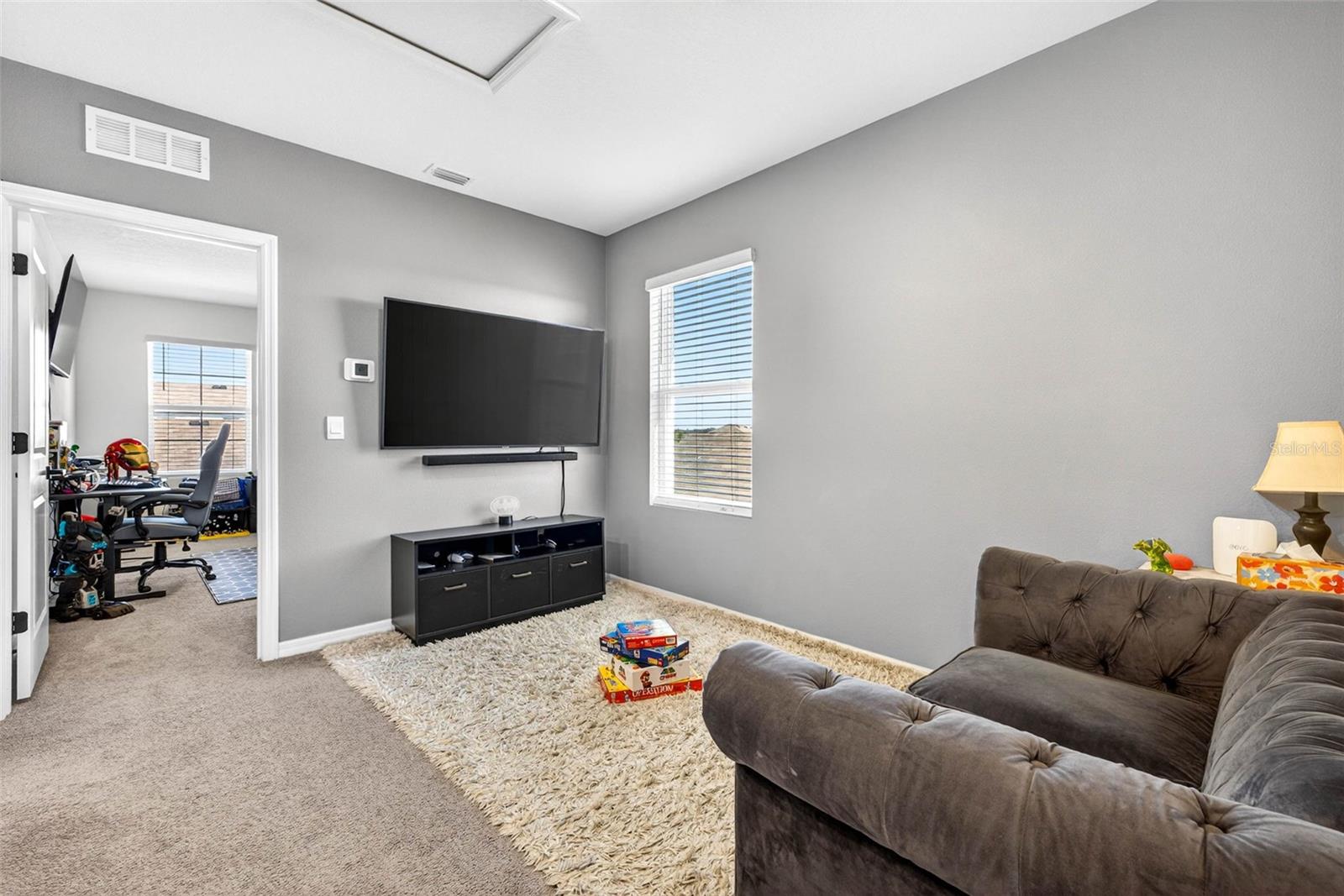 Loft creates the center of the 3 way split of bedrooms.