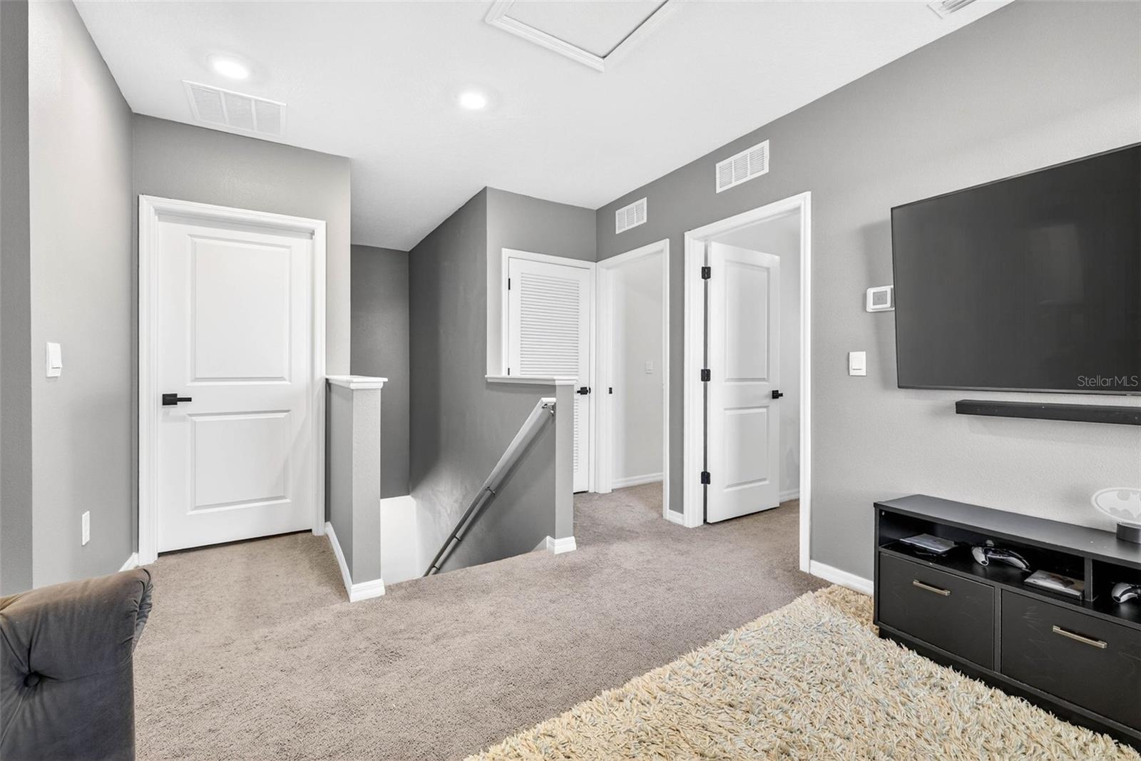 Two rooms adjacent, primary straight ahead, 1 bedroom down the hallway.