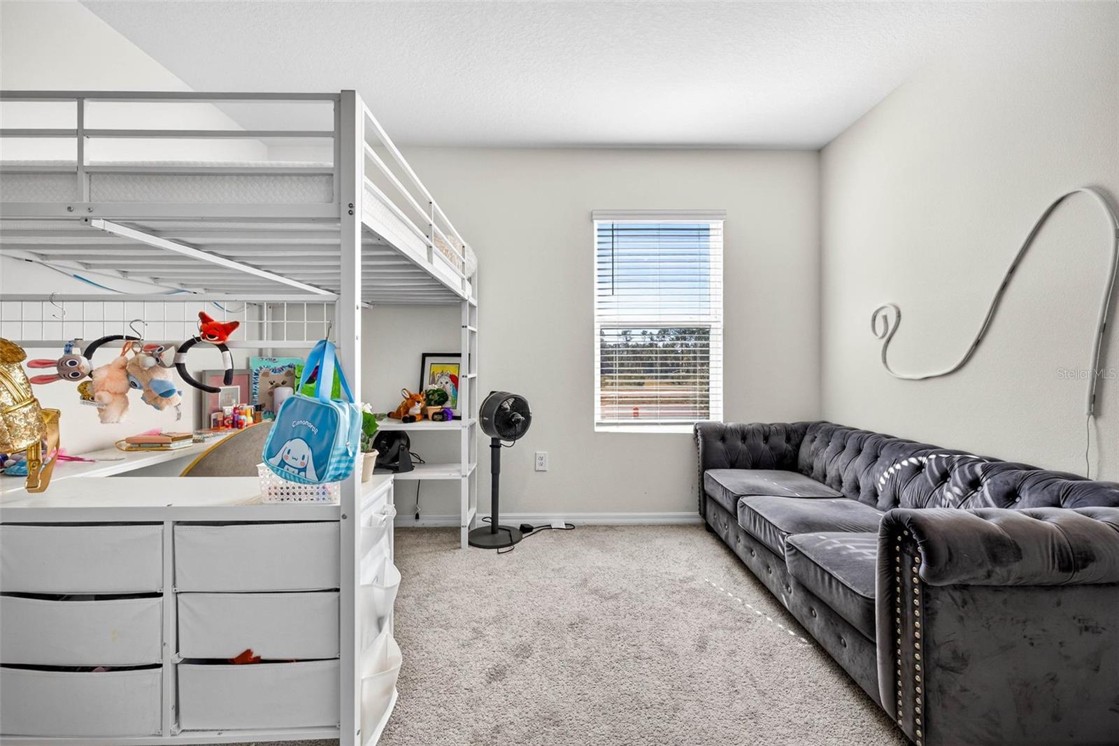 Bedroom 4 perfect for a larger space with couch, elevated bed + a desk.