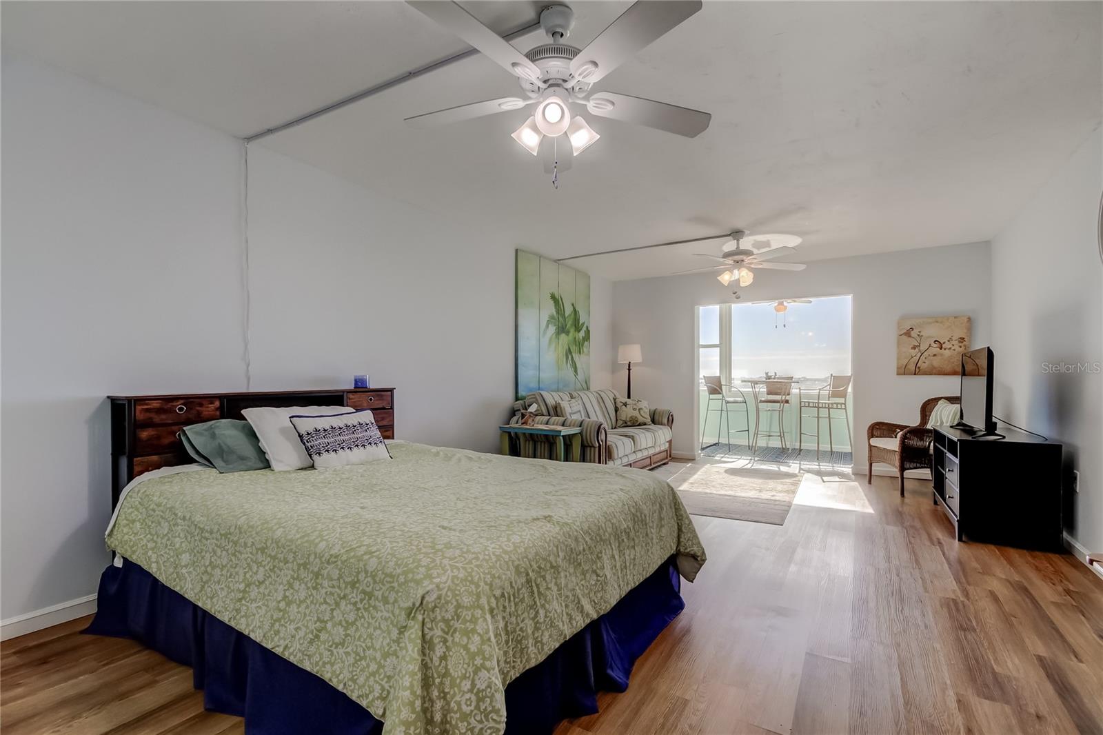 Two Ceiling Fans and Luxury Vinyl Plank Flooring