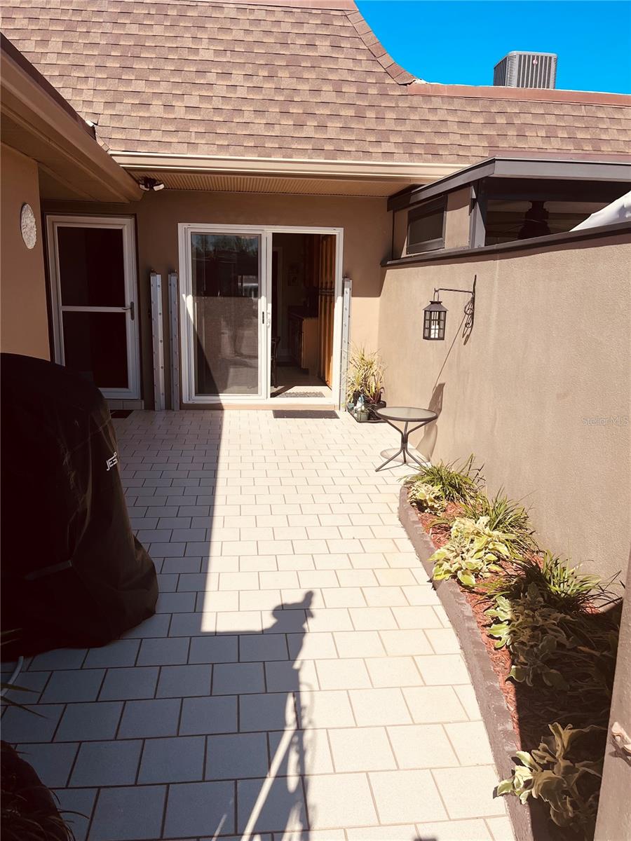 Room for an outdoor barbecue And sliding doors to both the kitchen and the second bedroom plus a main door to your garage!
