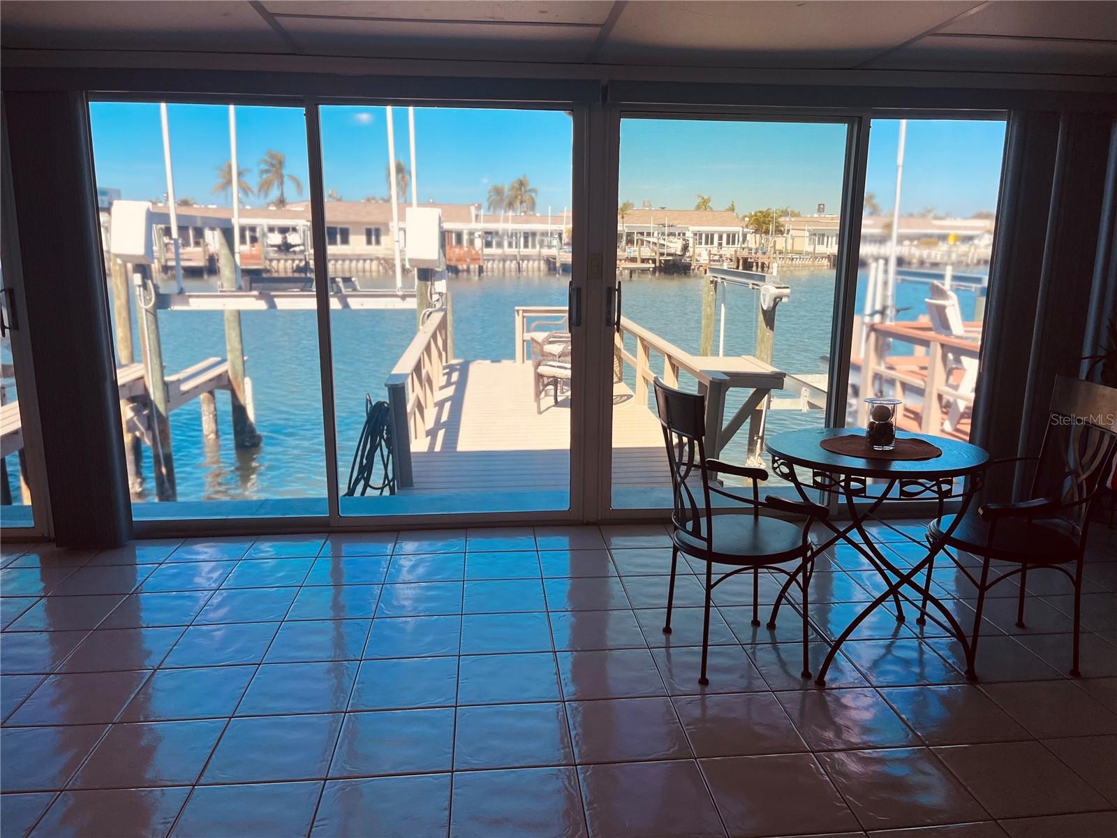 Standing in the center of the Florida room, looking at your boat lift and composite dock!