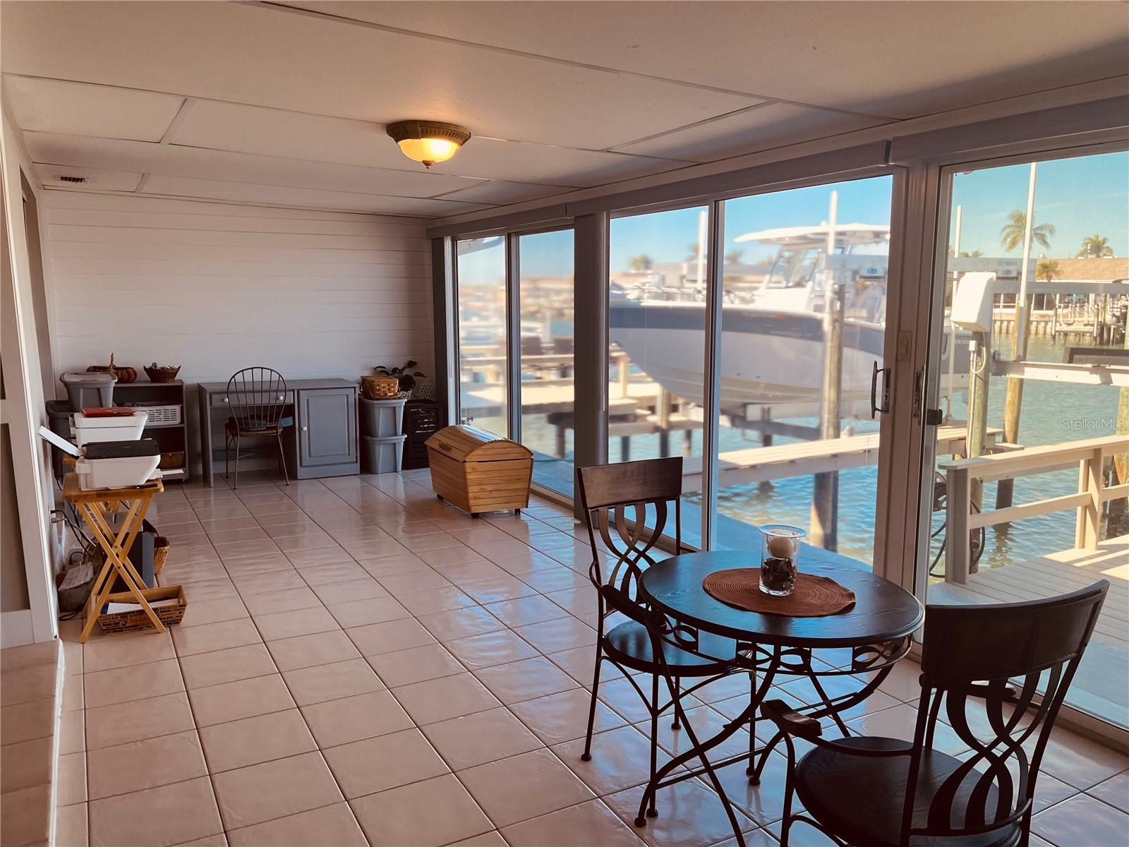 Another view from your Florida room with three sets of sliders, letting in so much beautiful natural light, and providing the epitome of a Florida life!