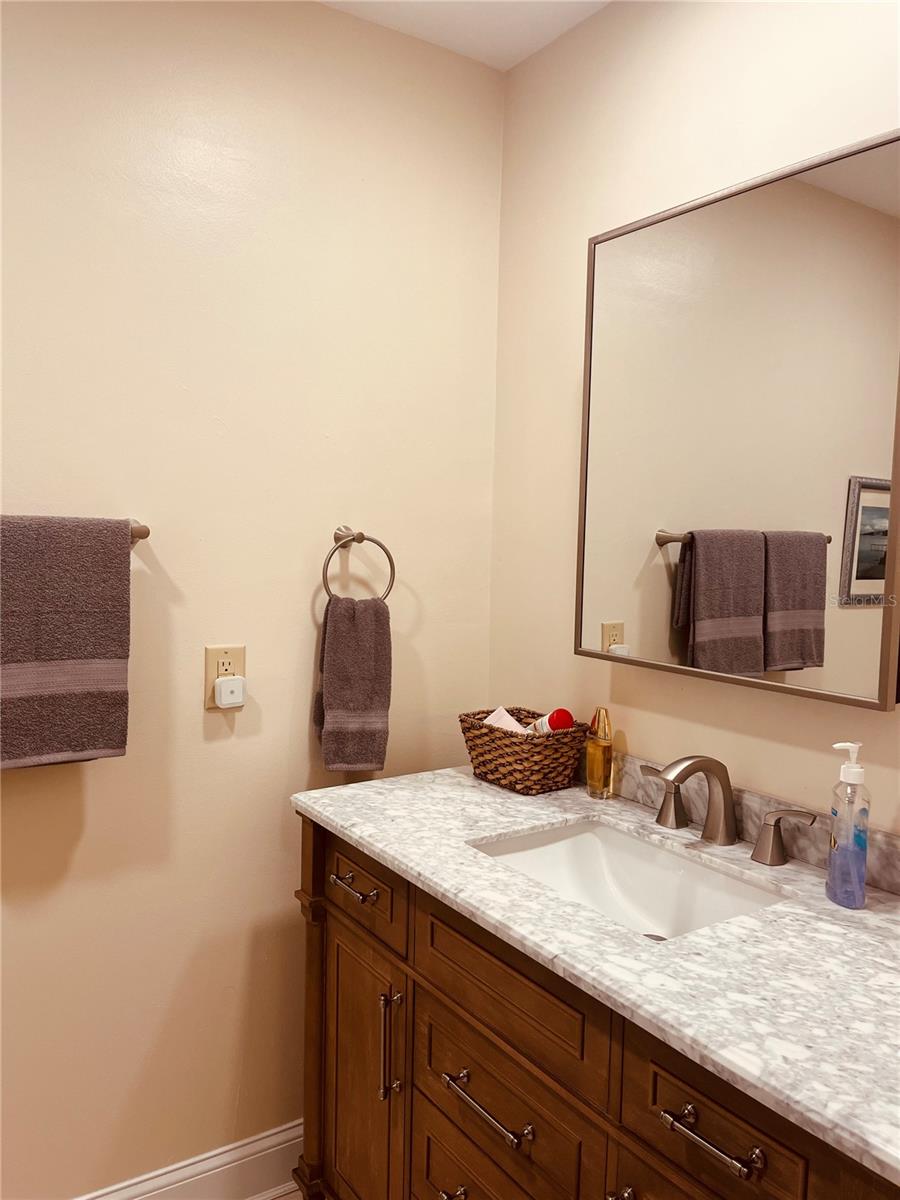 Another view of the primary bedroom, bathroom vanity!