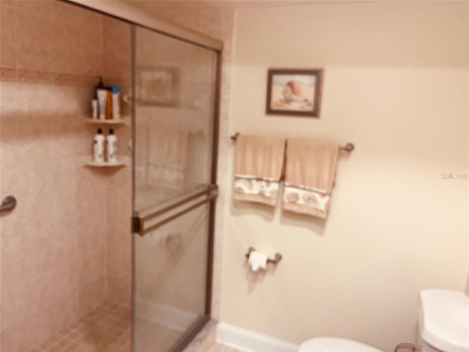 Your walk-in shower adjacent to the second bedroom and conveniently located for guests visit visiting!