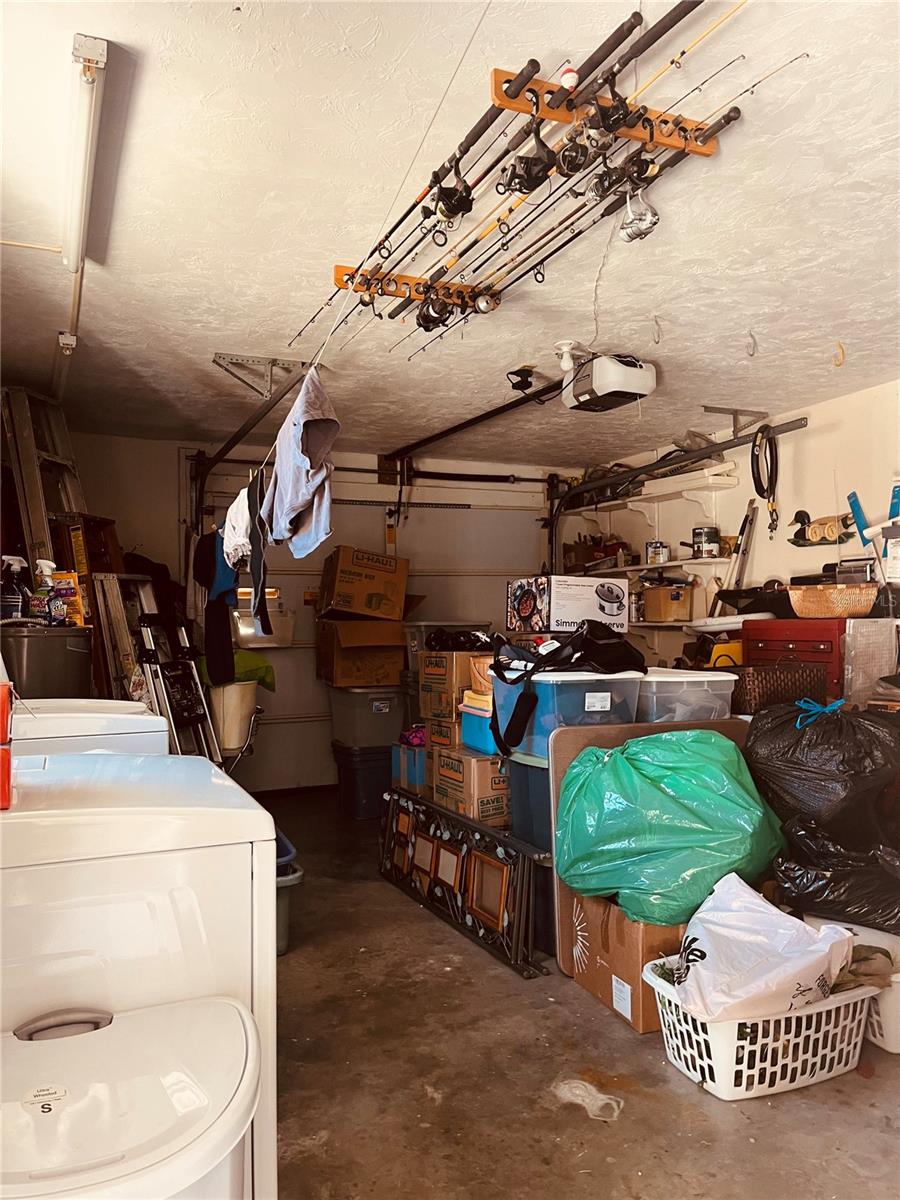 You’re one car garage complete with washer and dryer in room for your fishing poles off of your back deck!