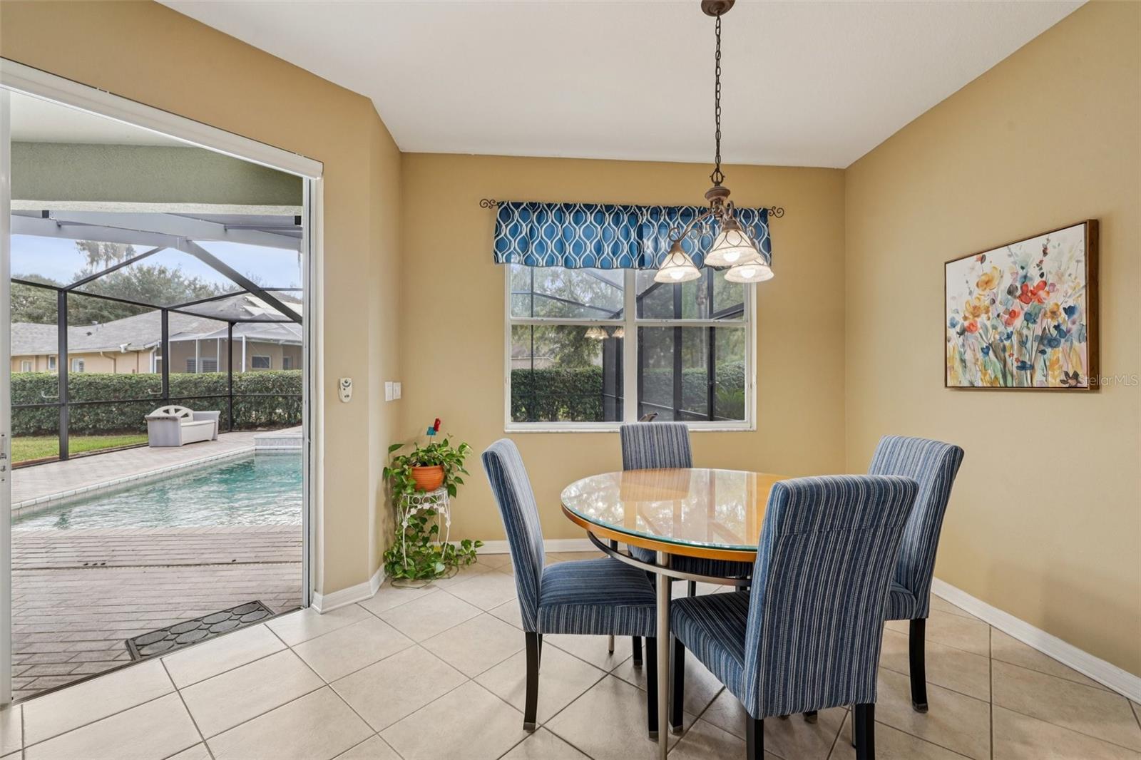 Dinette off of Kitchen and Family room with view to Lanai area